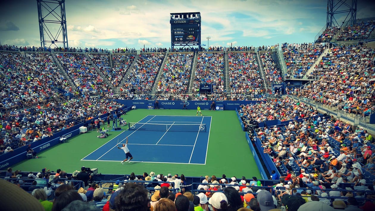 Arthur Ashe Stadium packed with fans during the US Open, lateral view from the stands