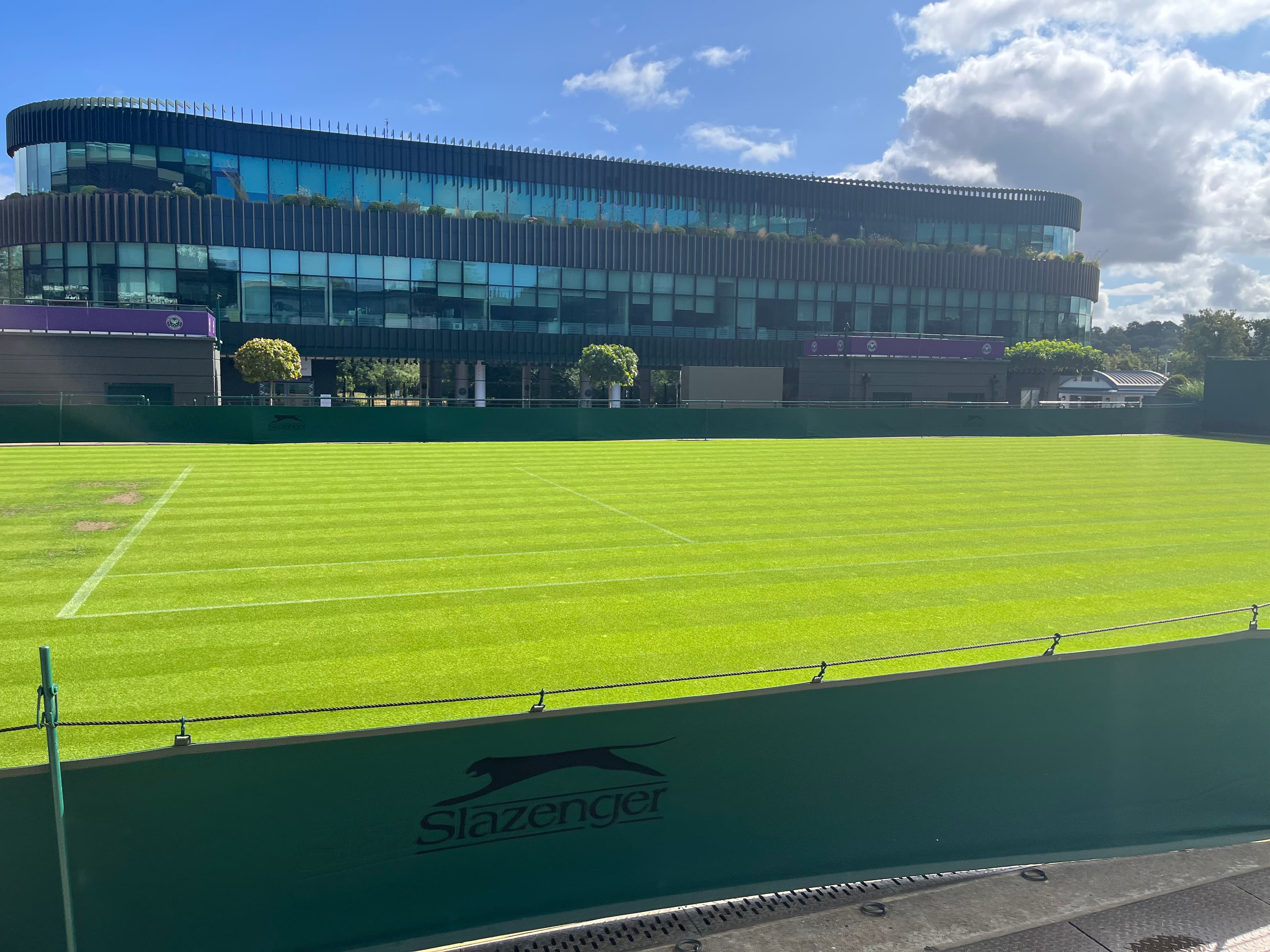 Grass court at Wimbledon's All England Club showing the distinctive turf and court lines